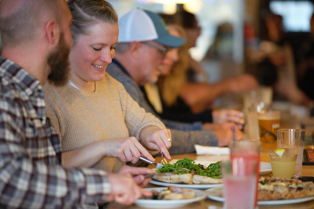 A couple sharing some pizza