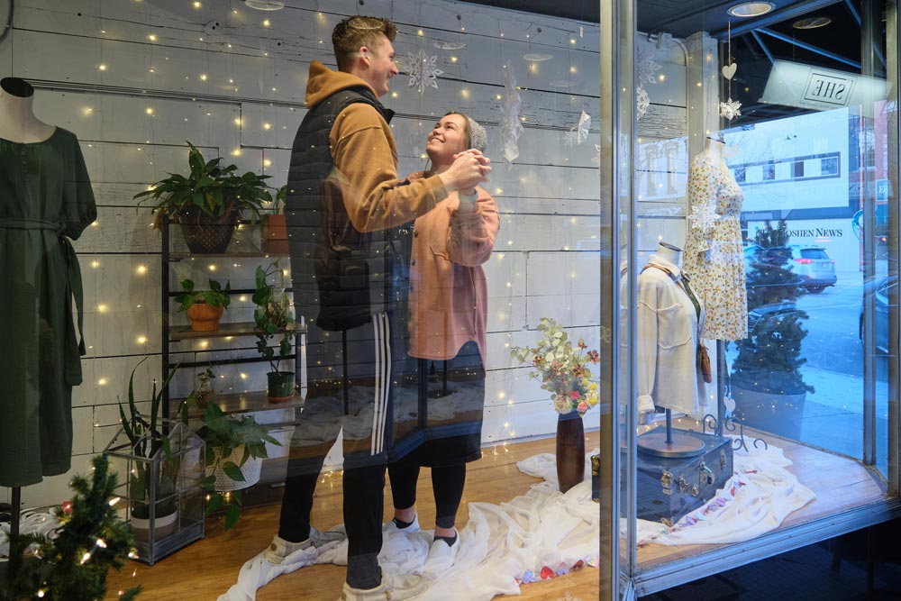image - a couple in a downtown display window