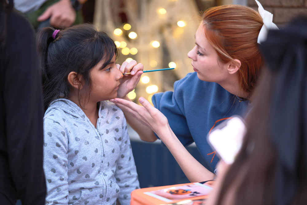Child getting her face painted