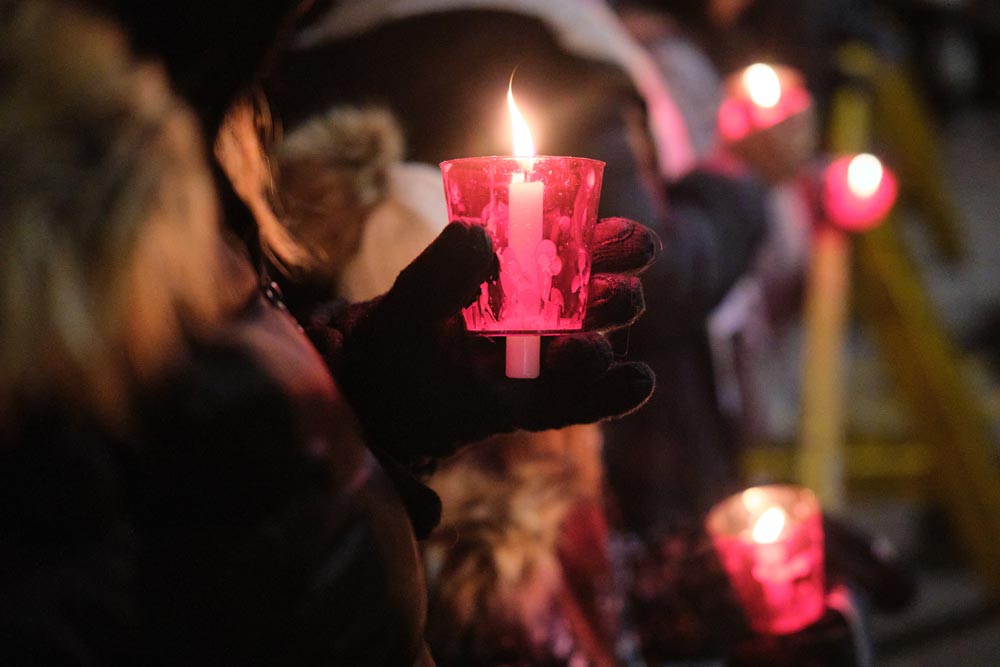 Caroling outside with candles