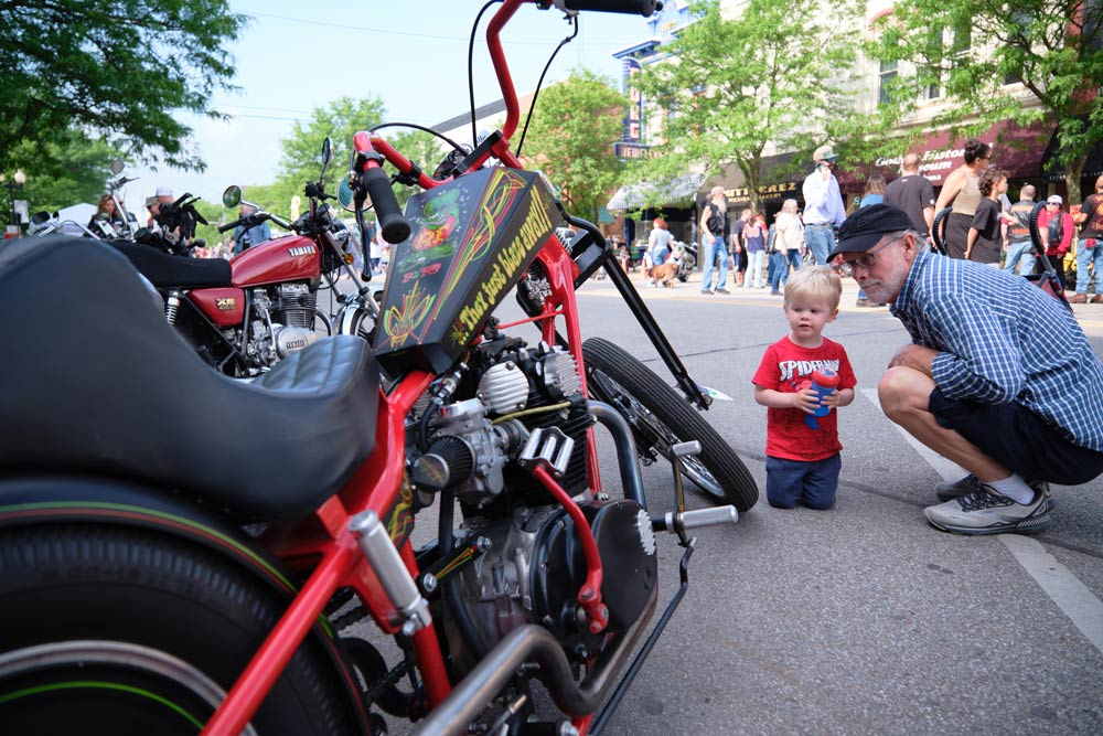 Father and son checking out the cool bikes